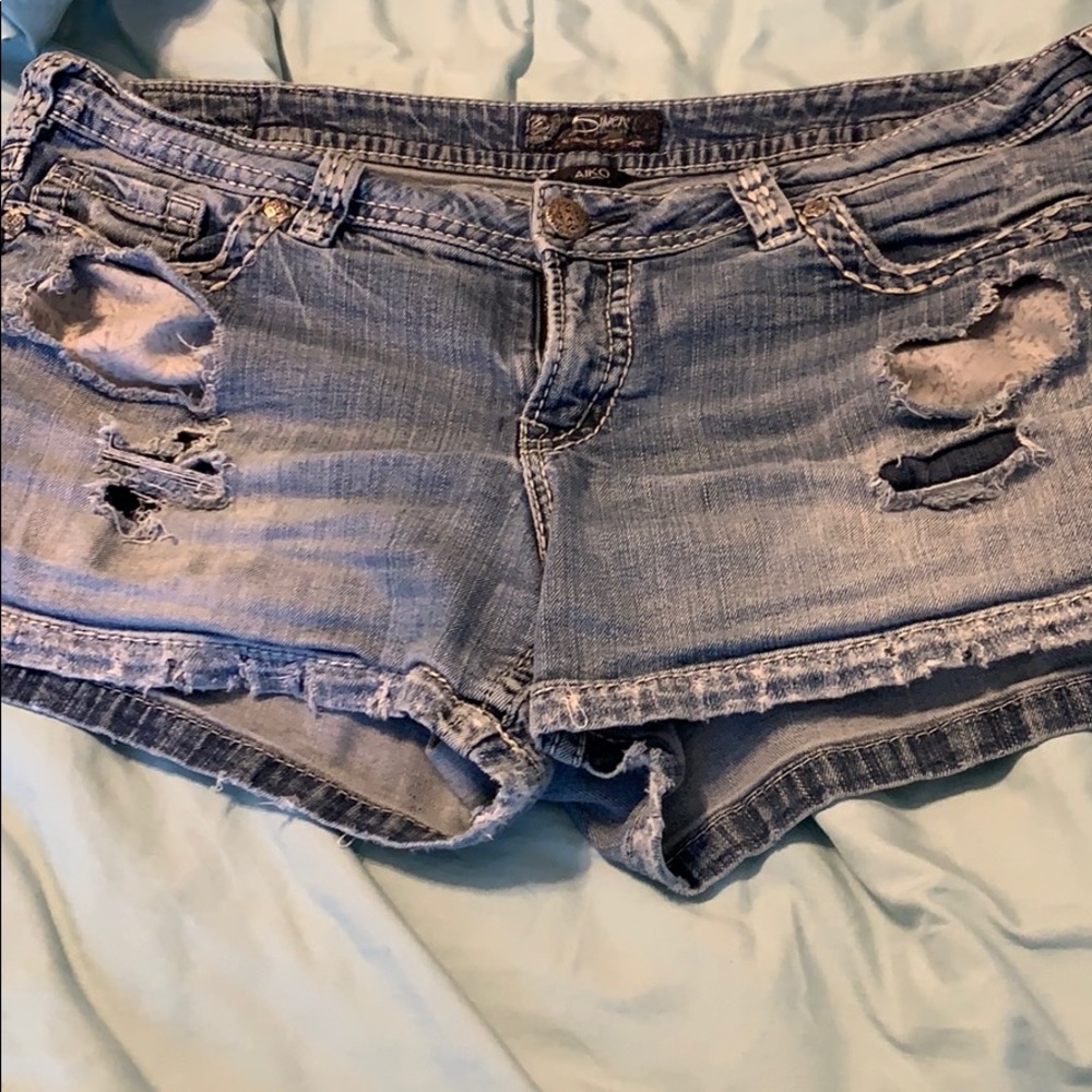 Silver distressed shorts.